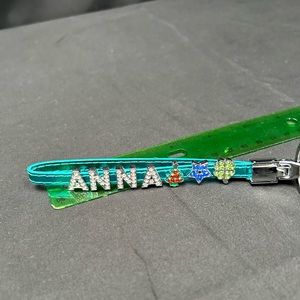 NWOT ANNA Charming Keychain. Studded Charms on the Blue Faux Leather Strap.